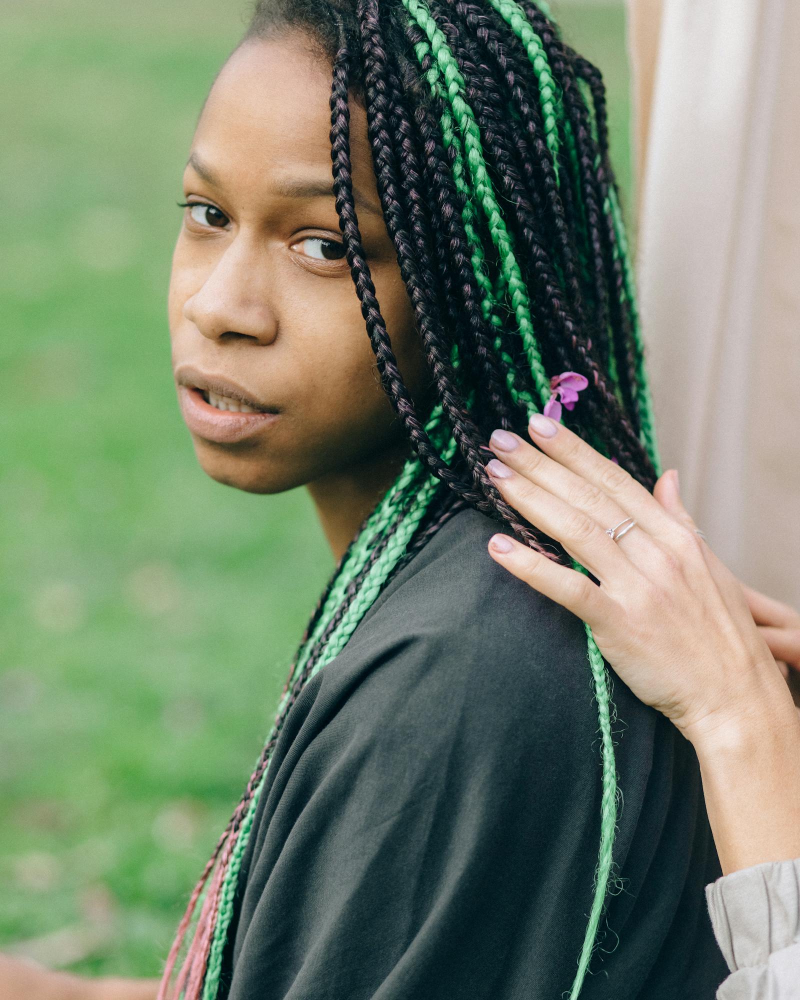 Green-accent box braids portrait