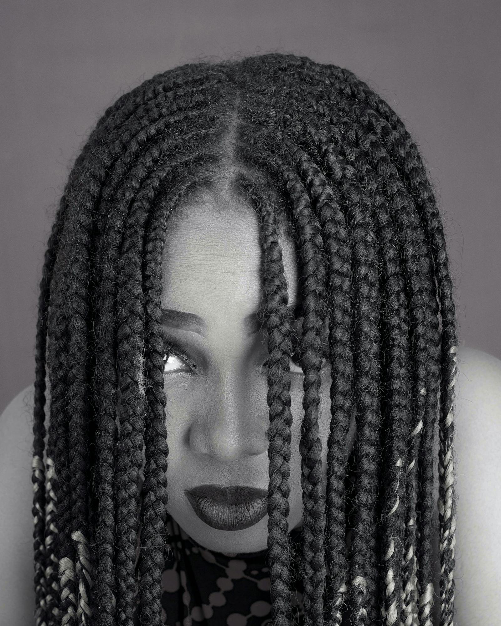 Editorial black-and-white box braids portrait